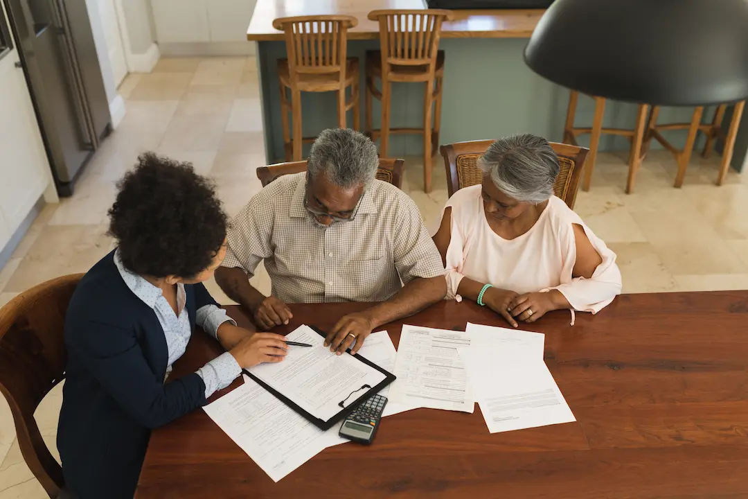 Couple reviewing roof financing documents
