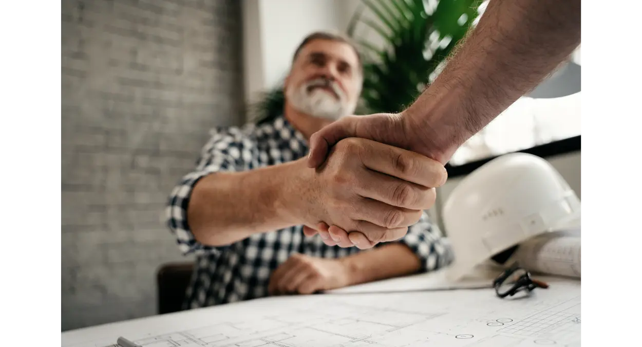 Contractor shaking hands with homeowner in Dallas