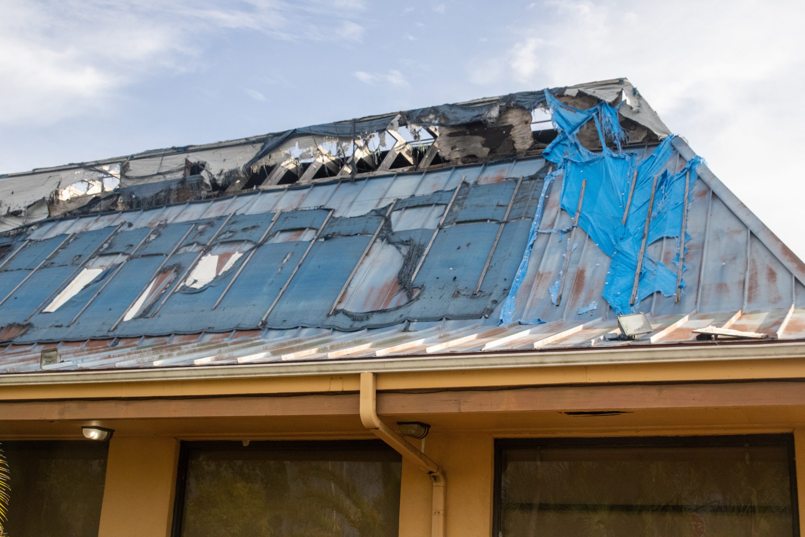 Roof inspector assessing storm damage